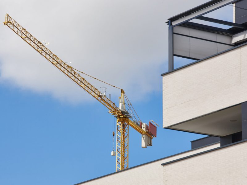 Modern building and crane machinery structure. Construction industry. Horizontal